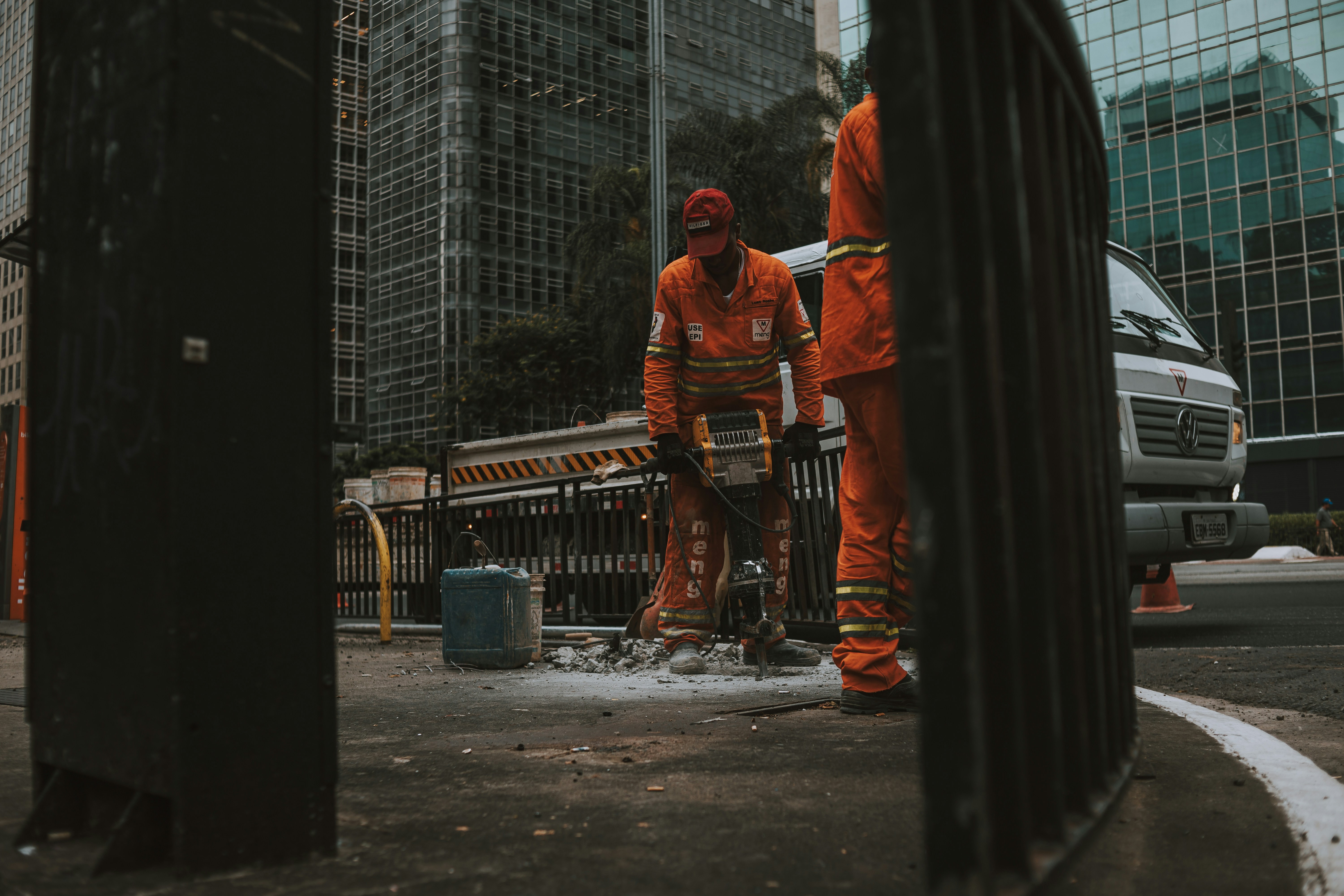 a couple of men standing next to each other on a street