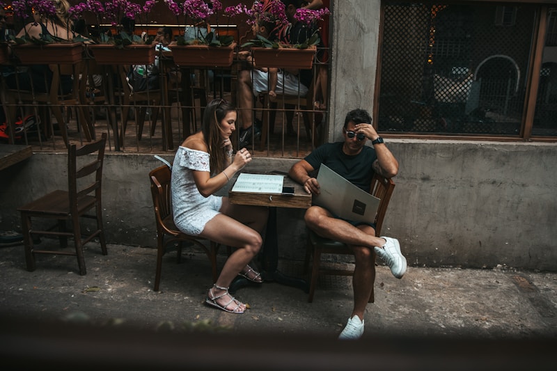 a man and a woman sitting at a table