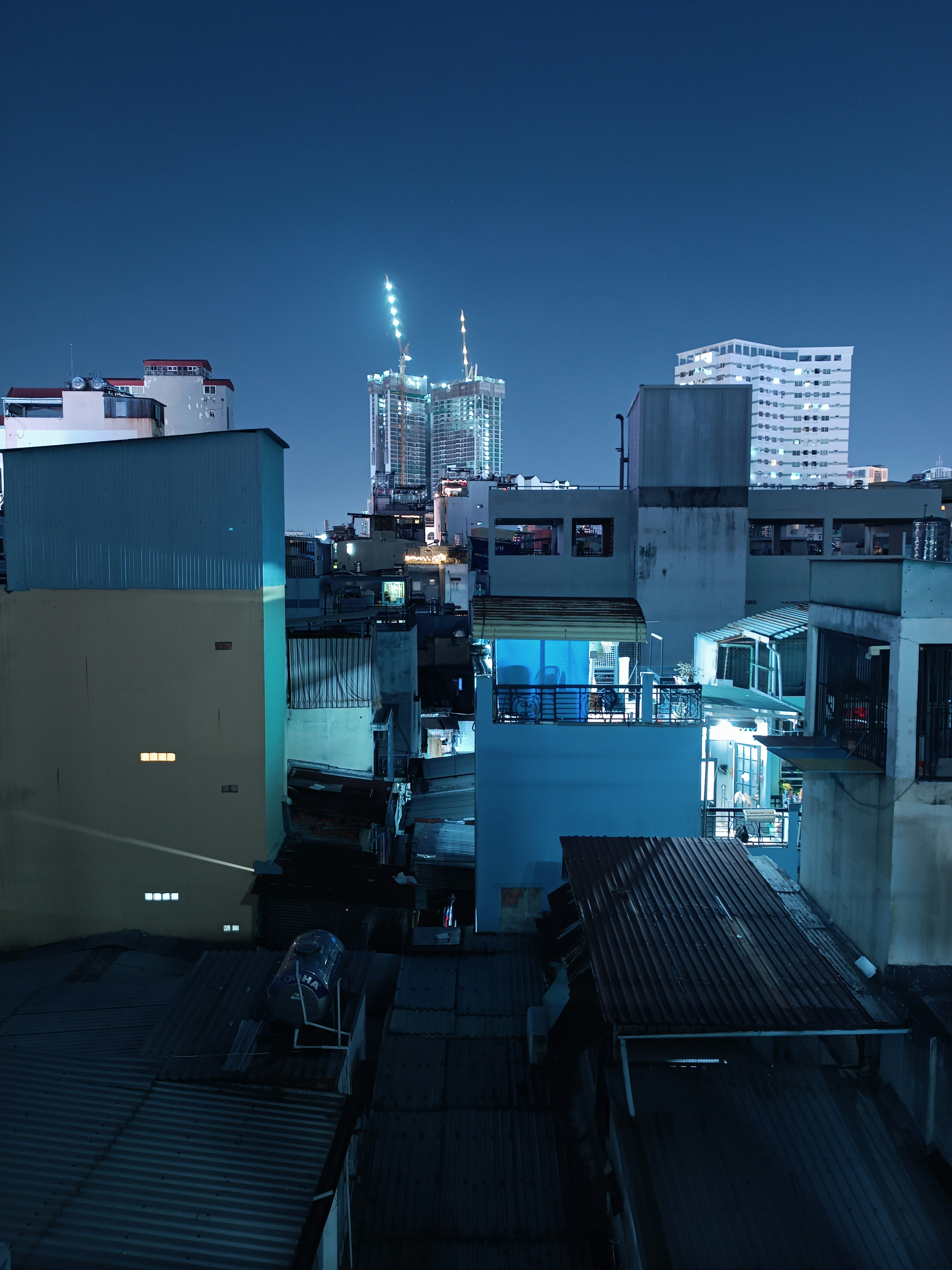 a view of a city at night from a rooftop