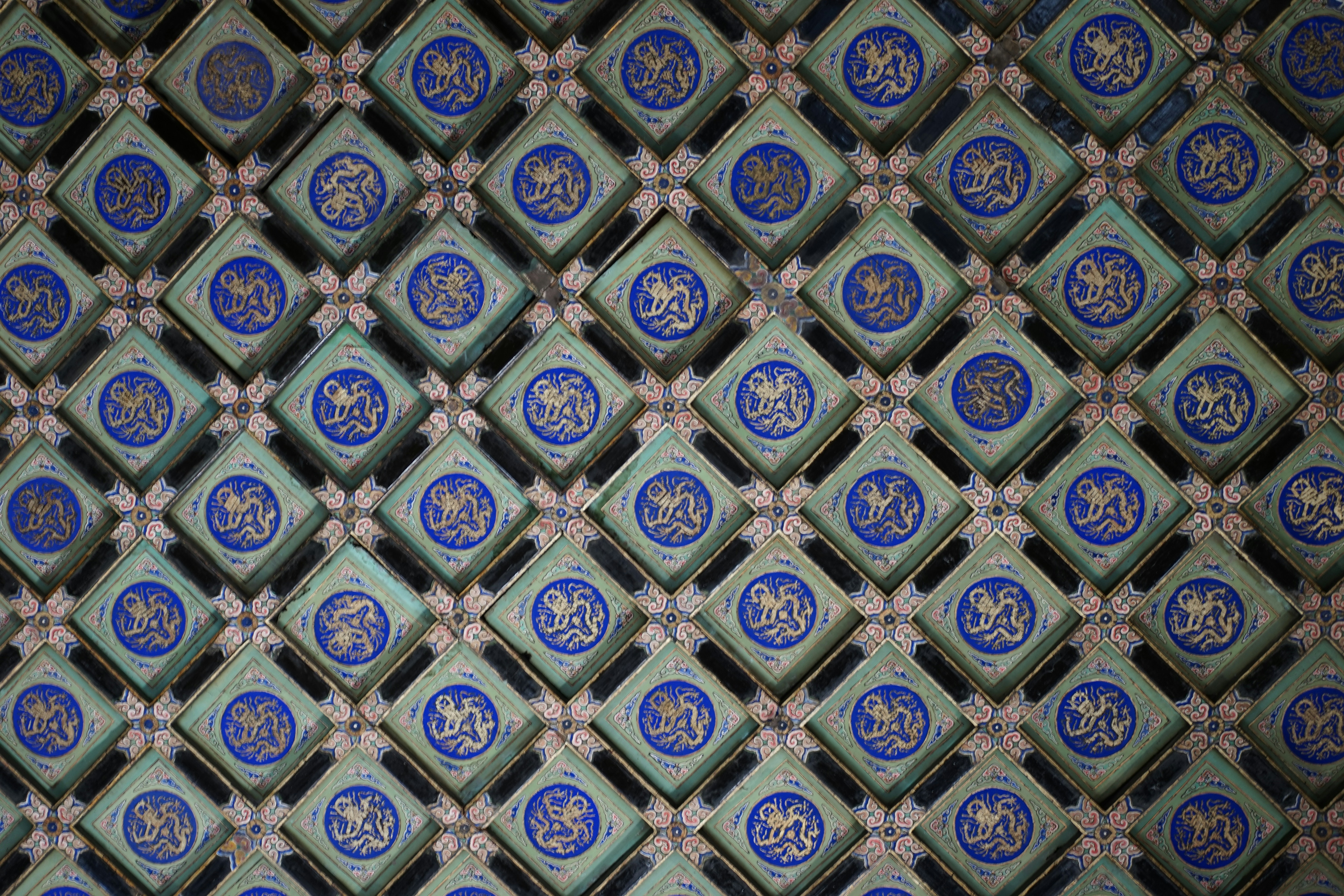 a close up of a blue and white tile pattern