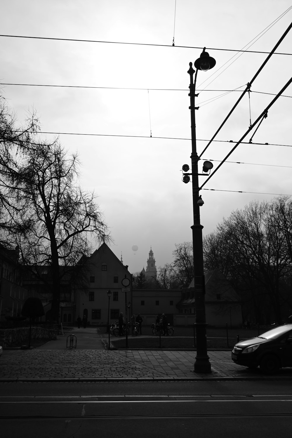 a black and white photo of a street light