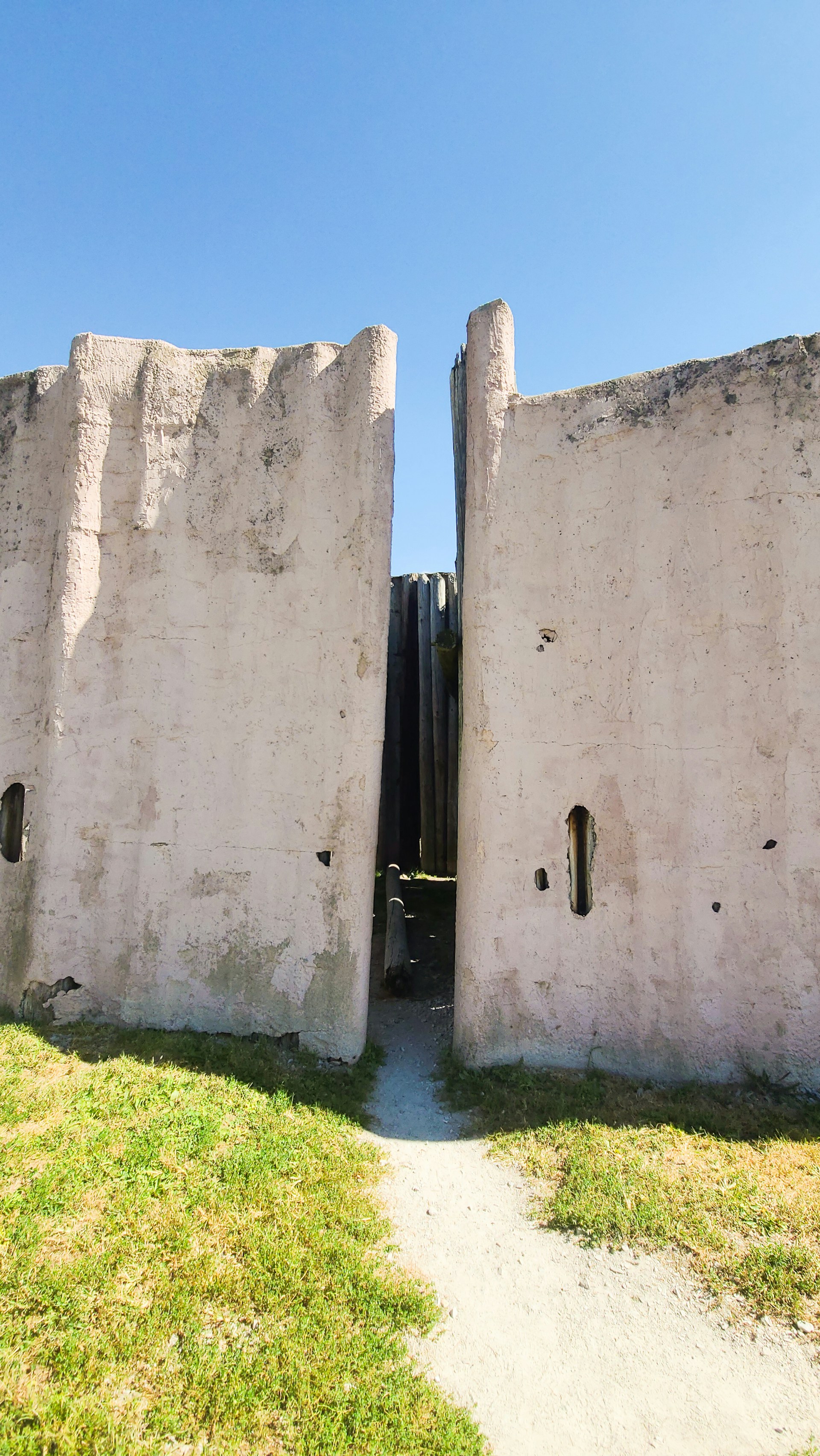 a stone wall with two holes in it