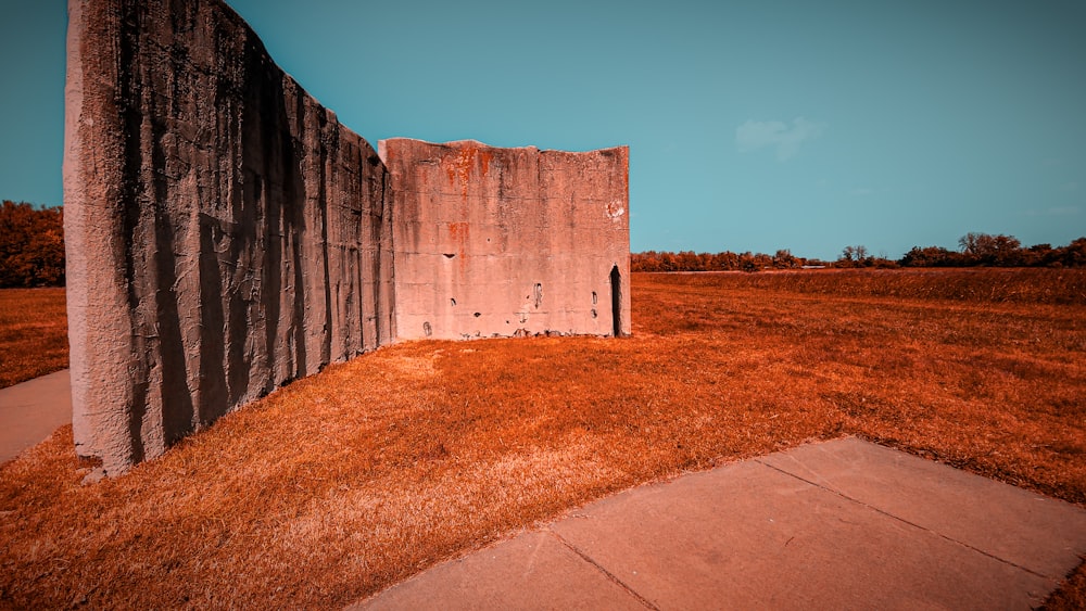 a concrete structure with grass growing out of it