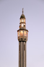 a tall tower with a clock on the top of it