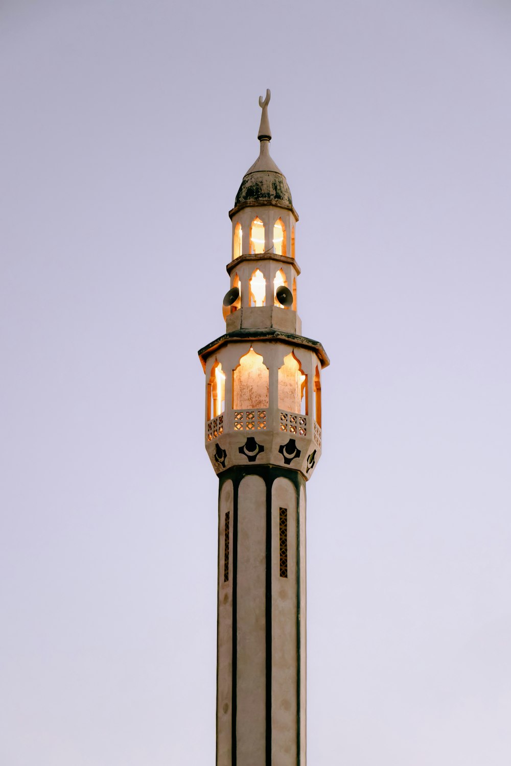 a tall tower with a clock on the top of it