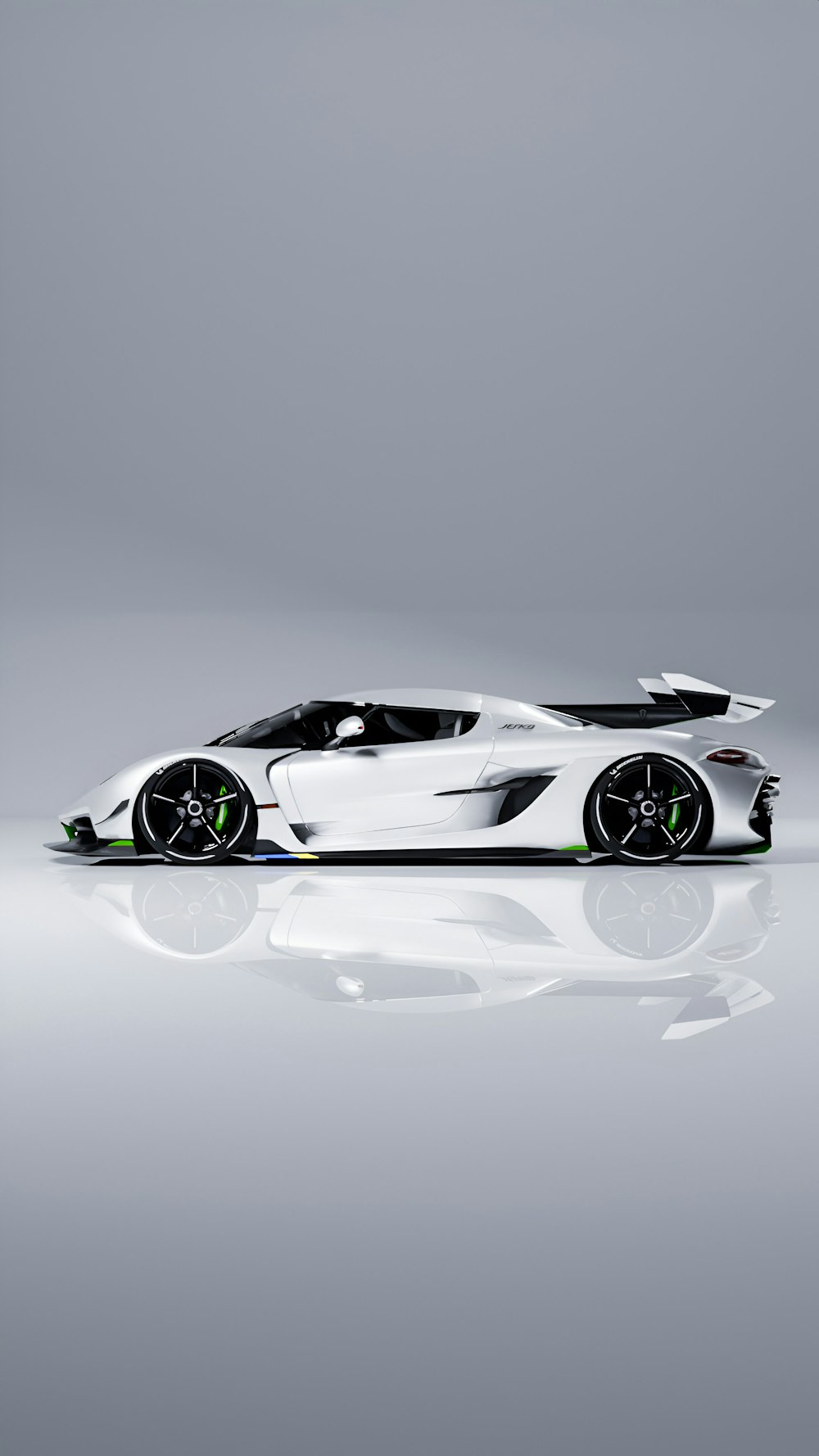 a white sports car on a reflective surface