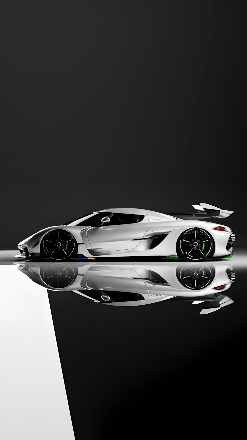 a white sports car is reflected in the water