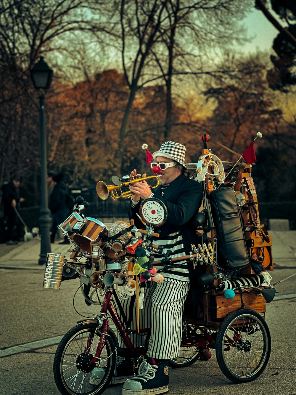 a man riding a bike with a bag on the back of it