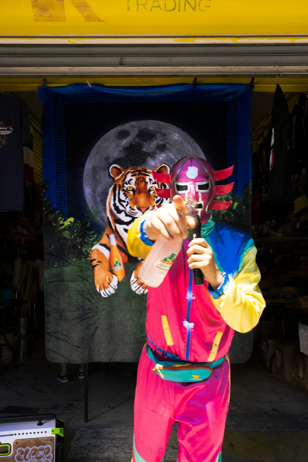 a man in a colorful outfit holding a baseball bat