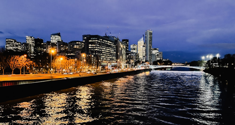 a view of a city at night from a river