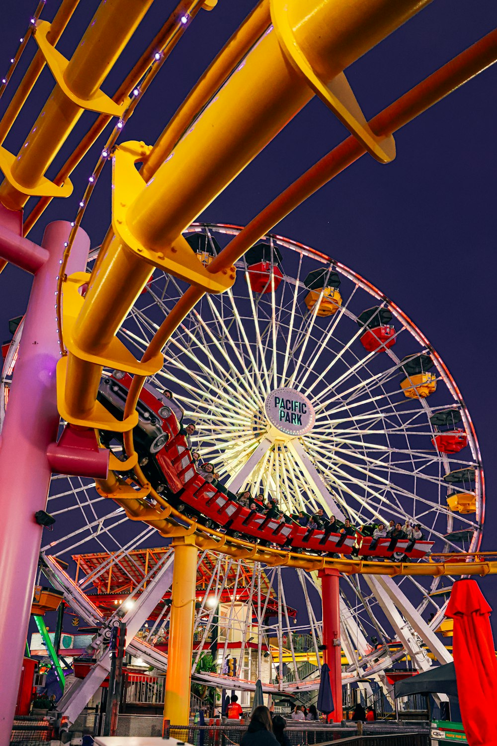 a ferris wheel in a carnival park at night