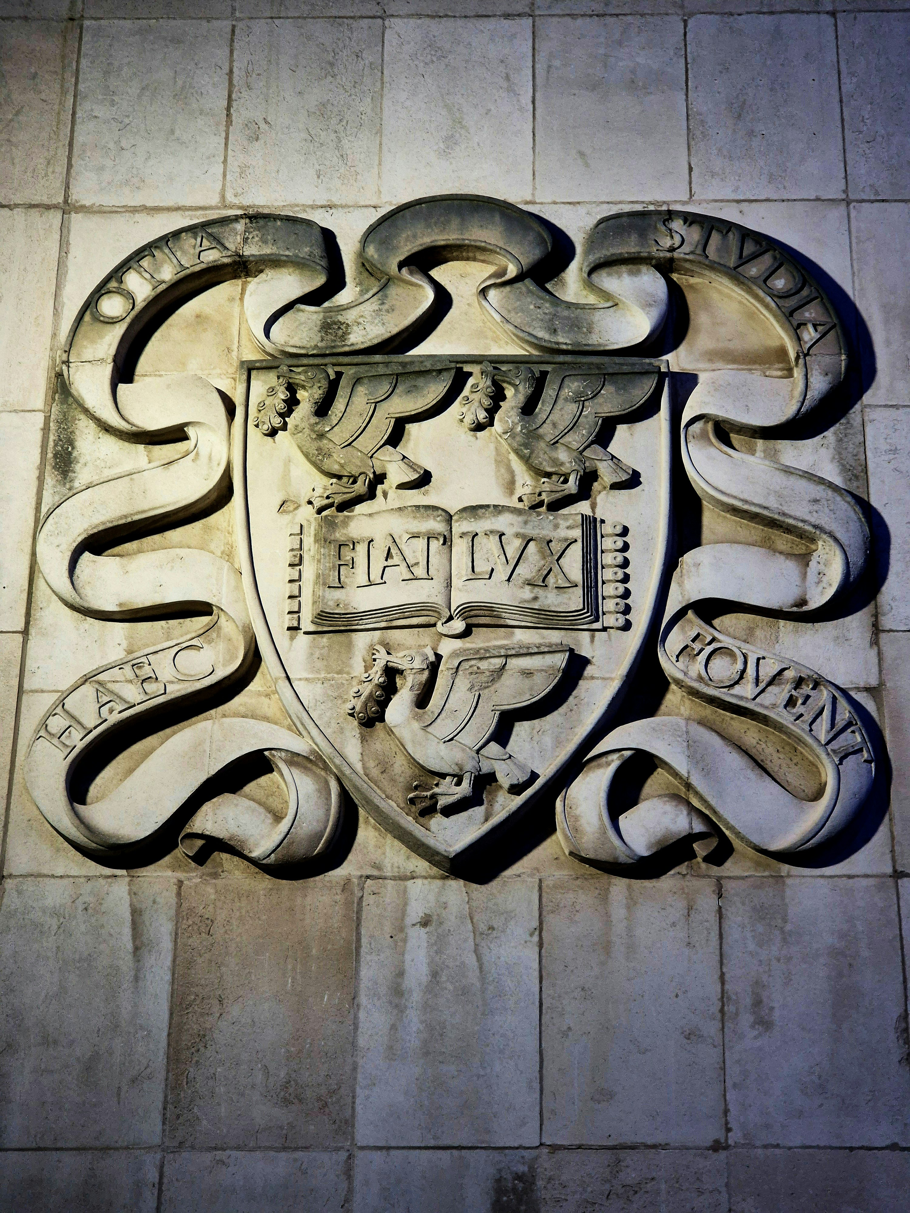 a coat of arms on the side of a building