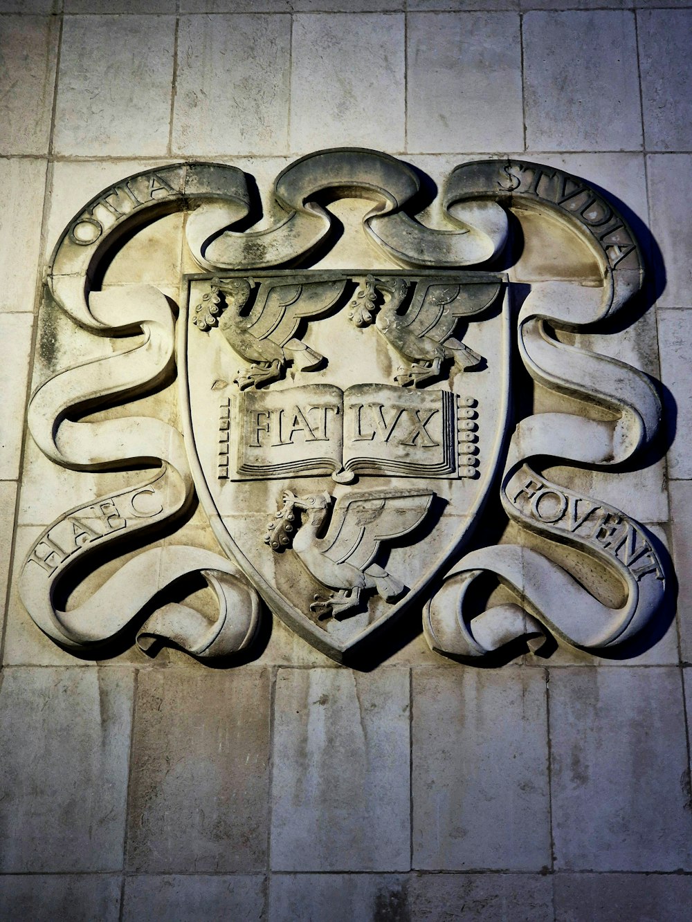 a coat of arms on the side of a building