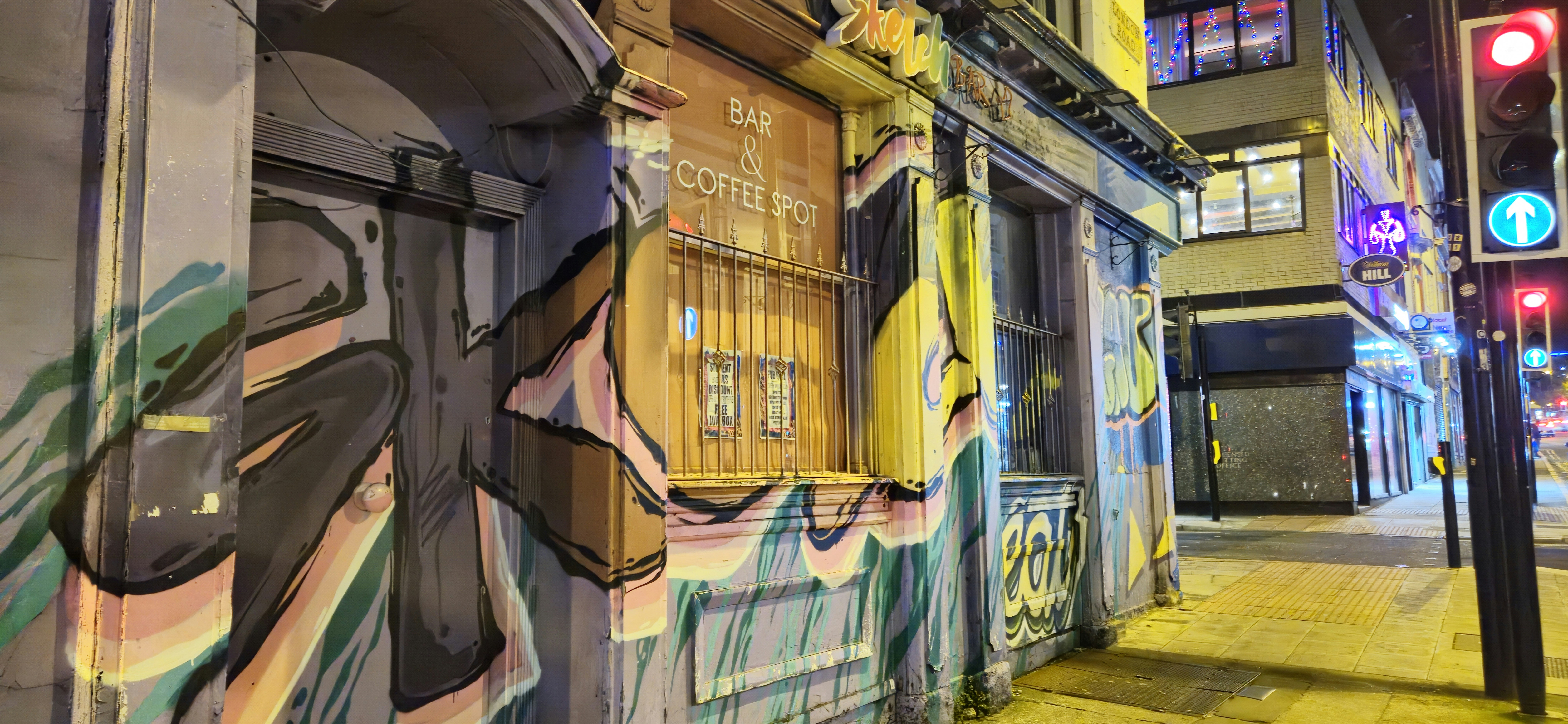 a building with a lot of graffiti on the side of it