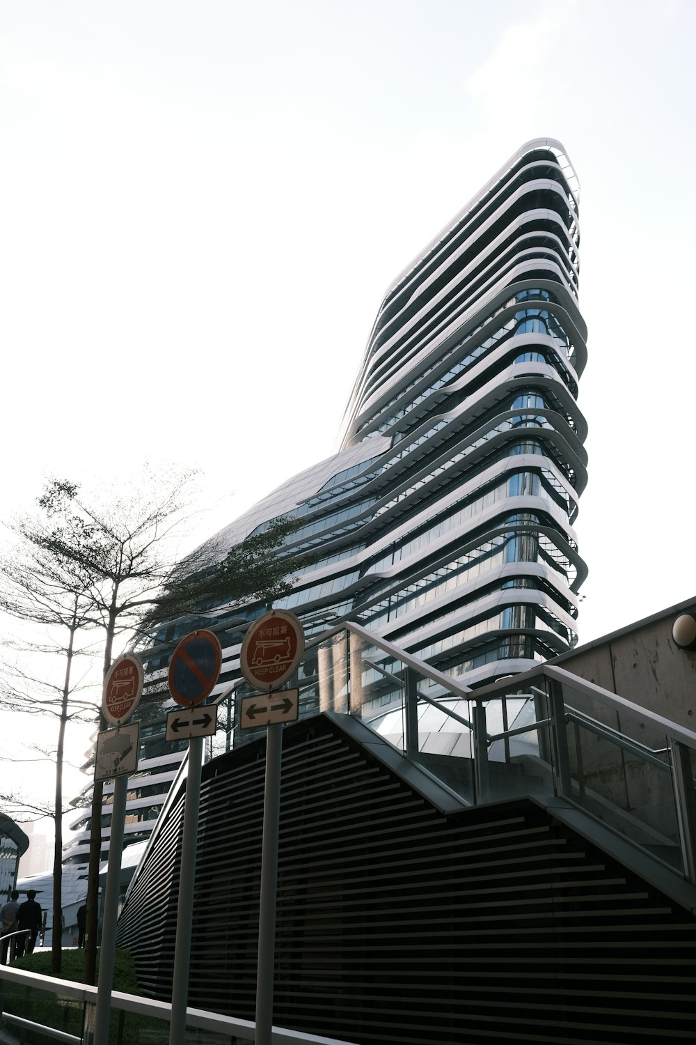 a tall building with a spiral design on top of it