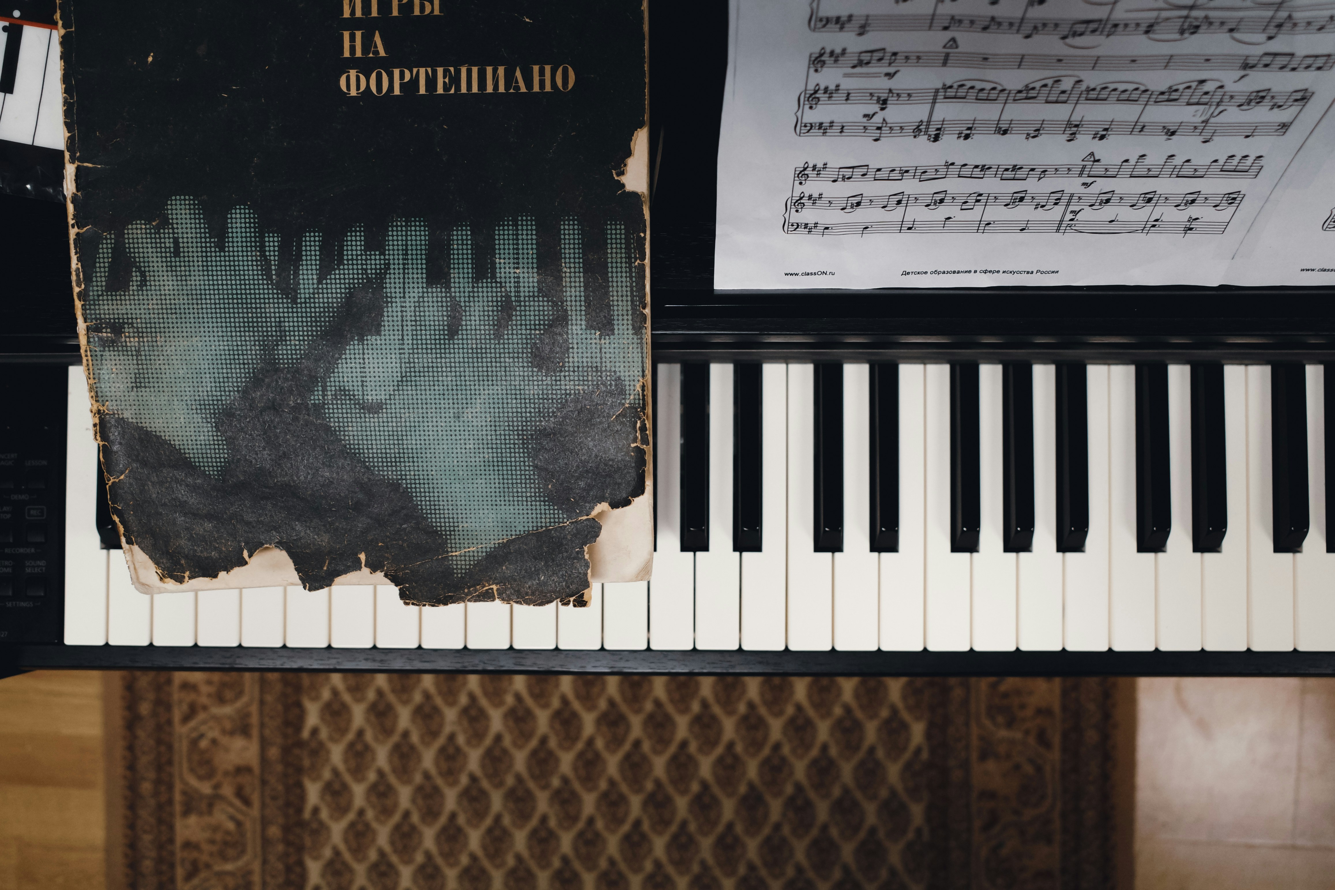 a piano with a sheet of music on top of it