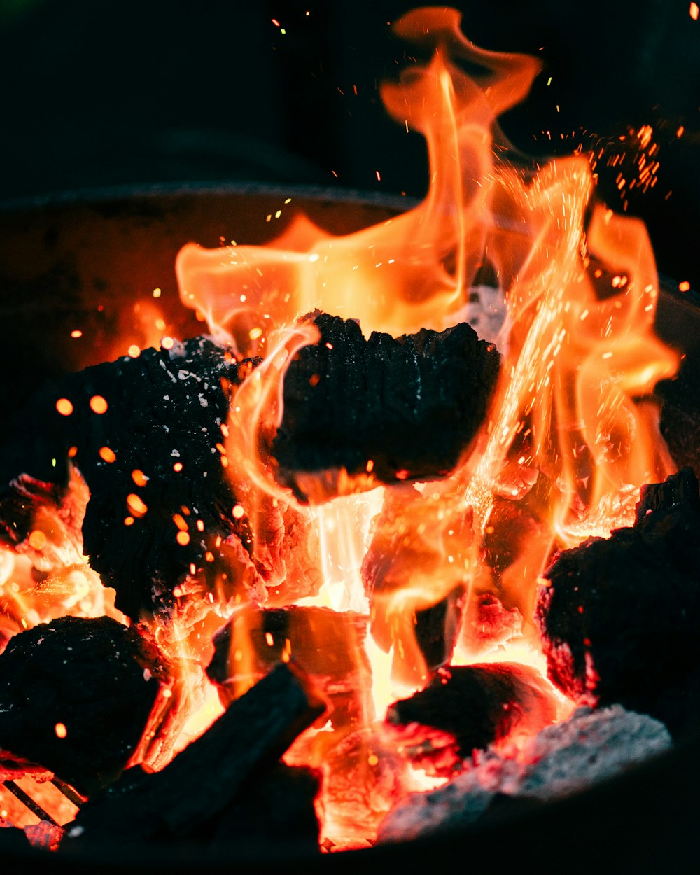 a close up of a fire burning in a pot
