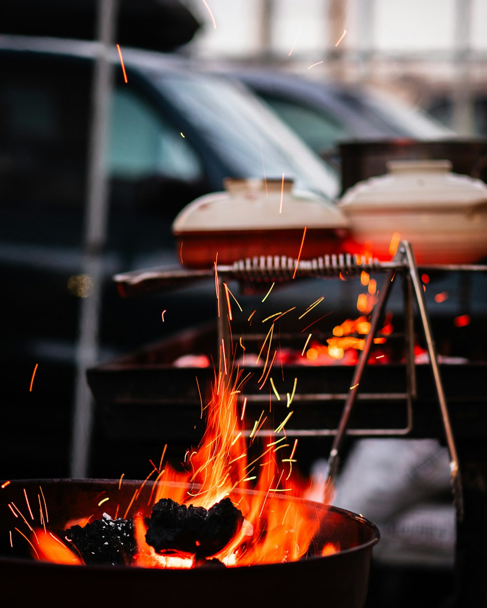 a grill with a fire burning inside of it