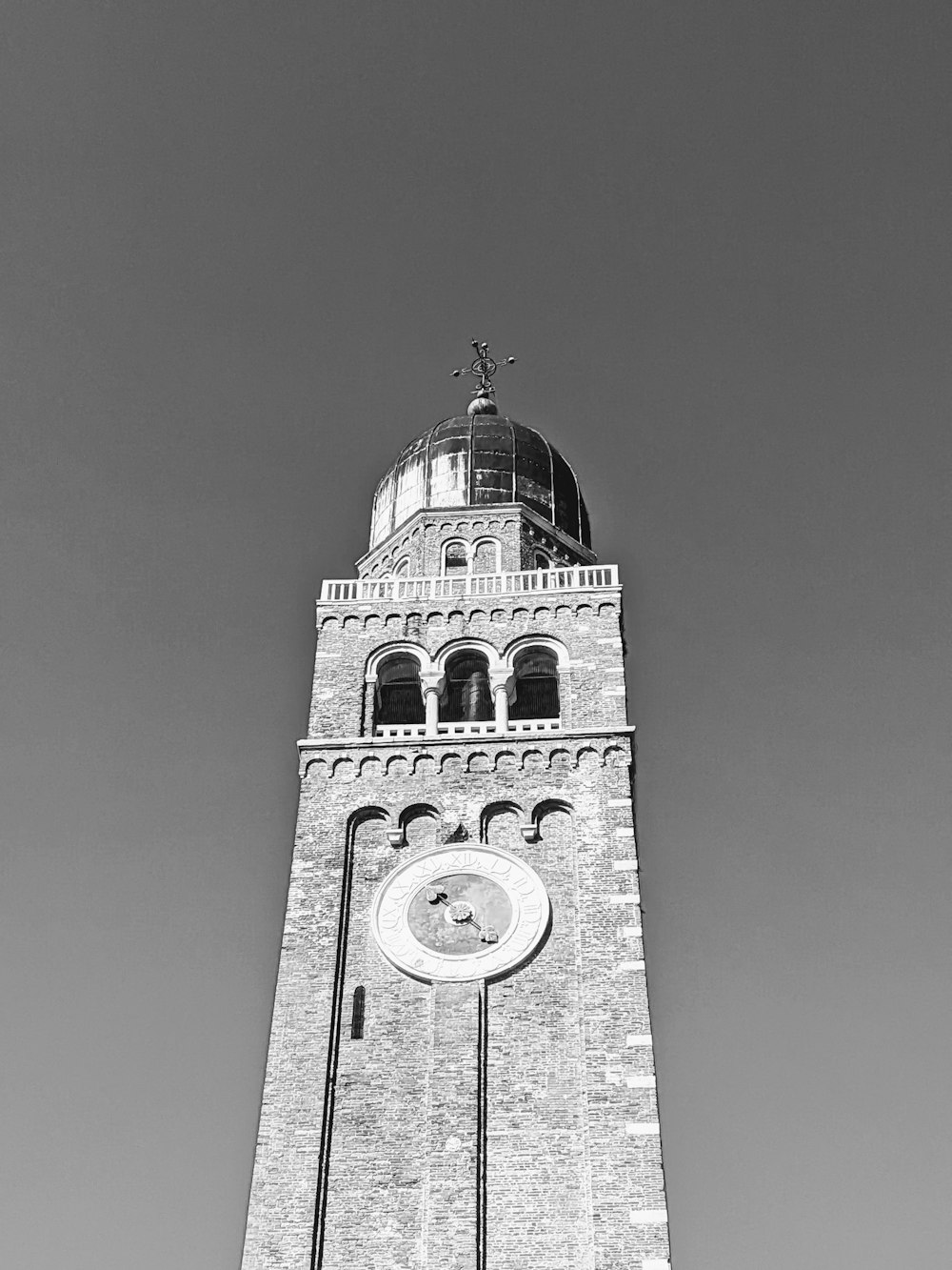 a black and white photo of a clock tower