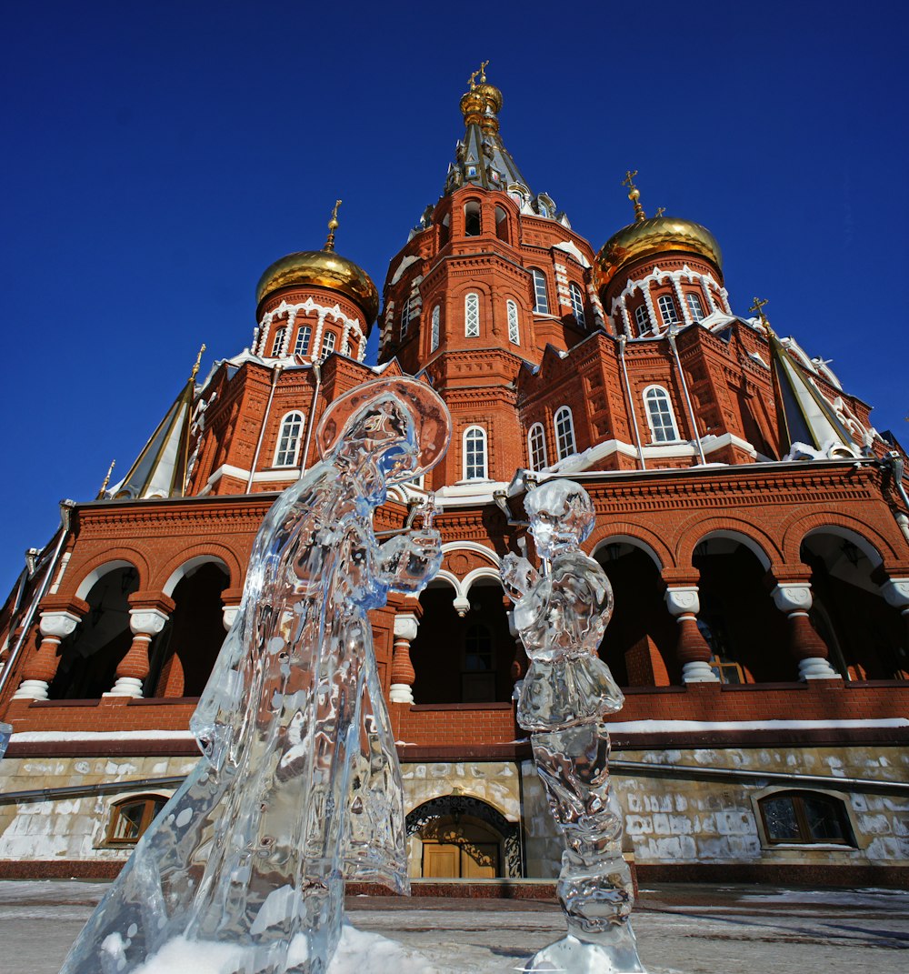 a couple of ice sculptures in front of a building