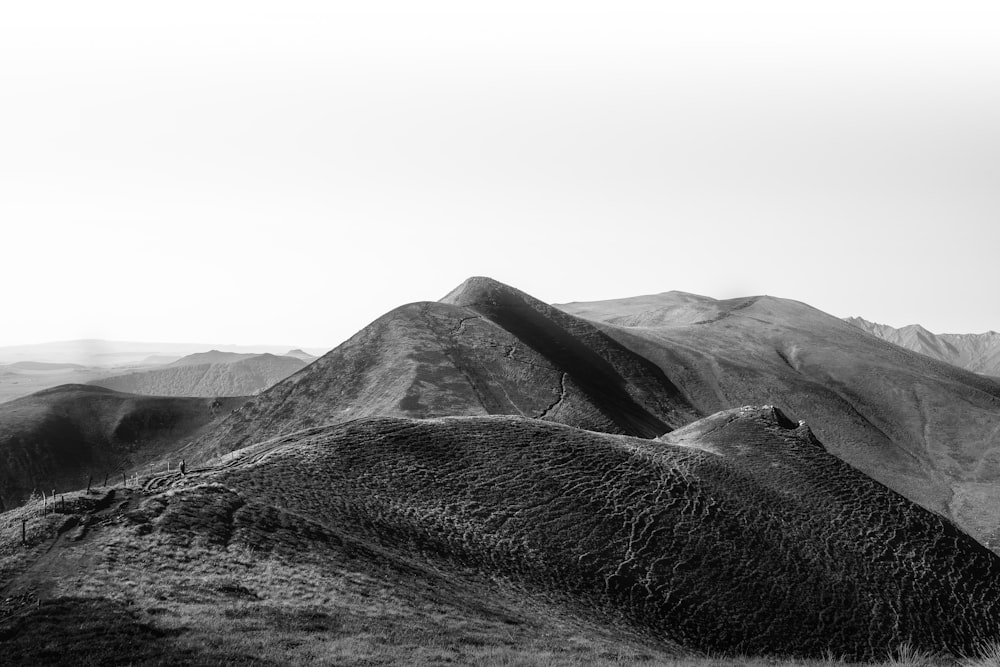 a black and white photo of a mountain range