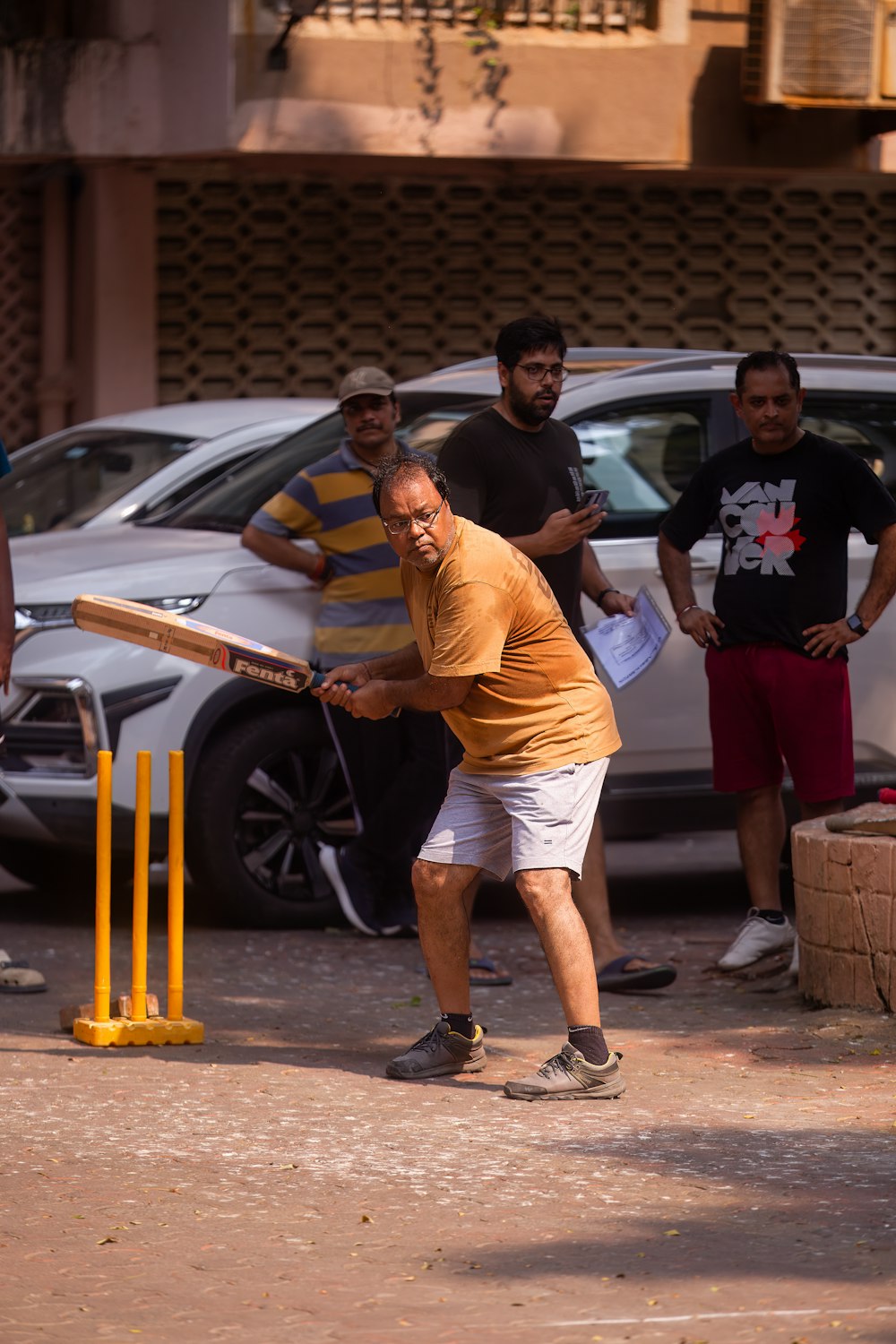 a man swinging a bat at a ball