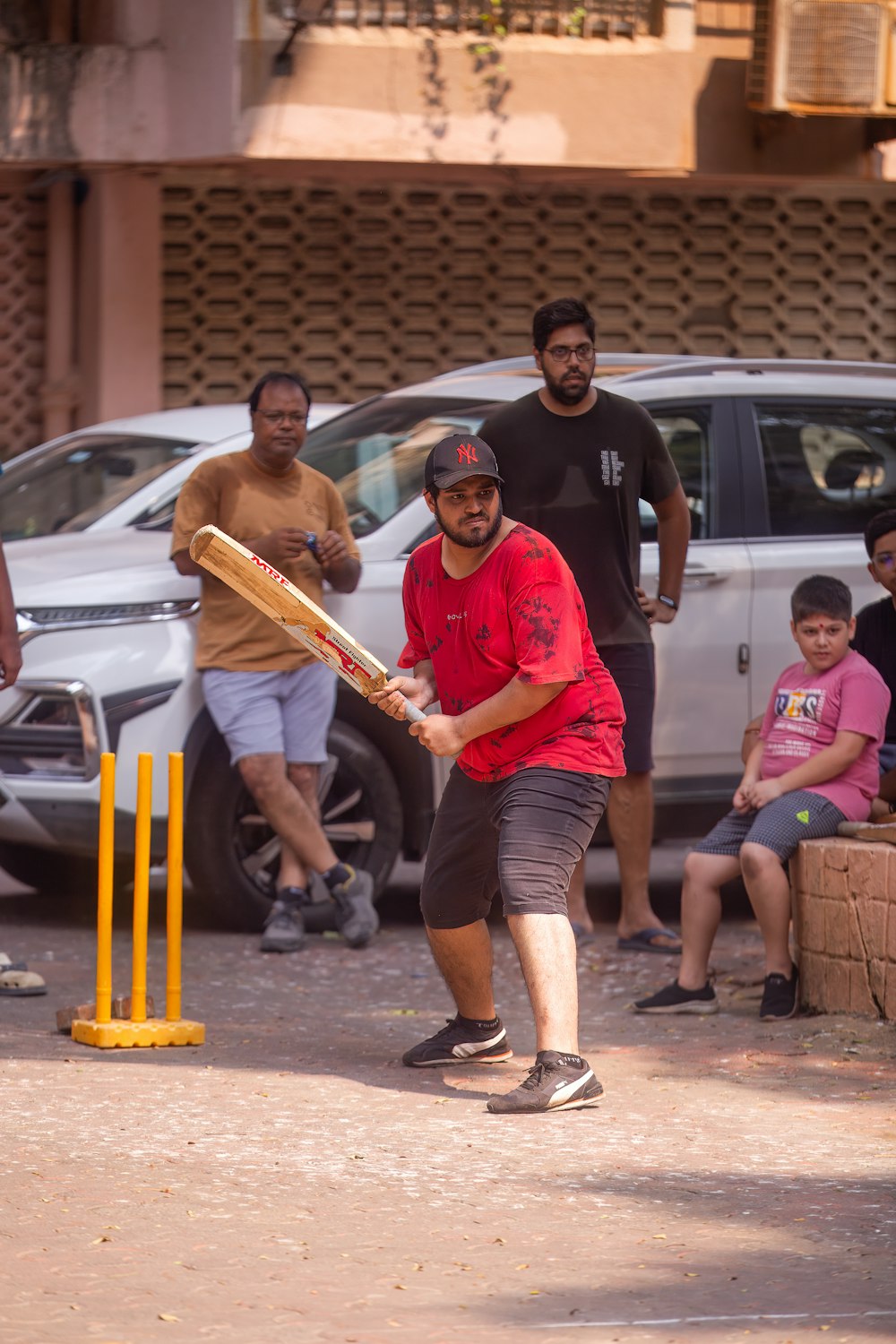 a group of men playing a game of cricket