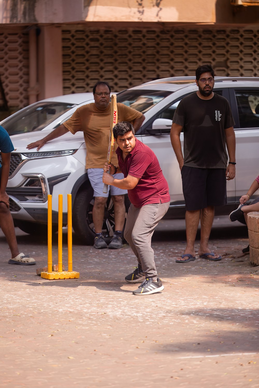 a man playing a game of croquet on the street