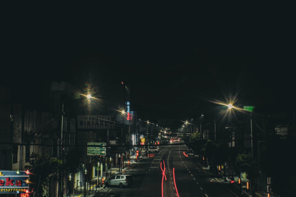 a city street at night with street lights