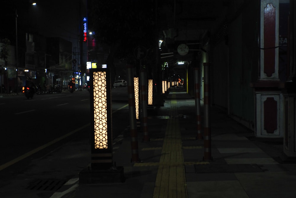 a city street at night with street lights