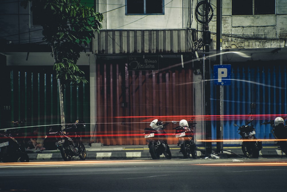 a group of people riding motorcycles down a street