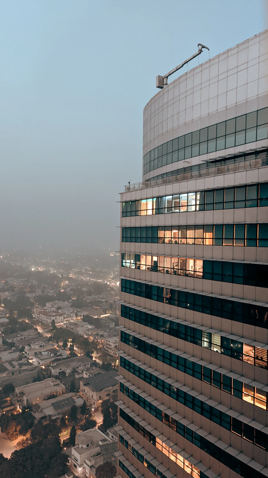 A high-rise overlooking Islamabad at dusk