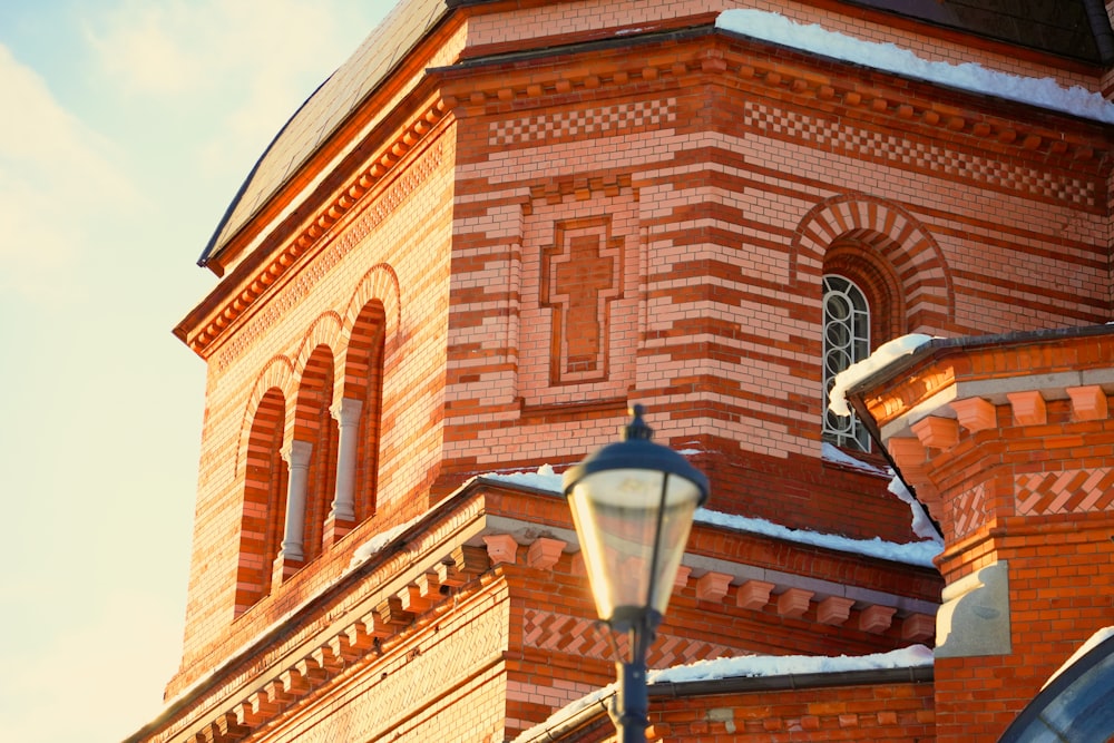 a brick building with a clock on the side of it