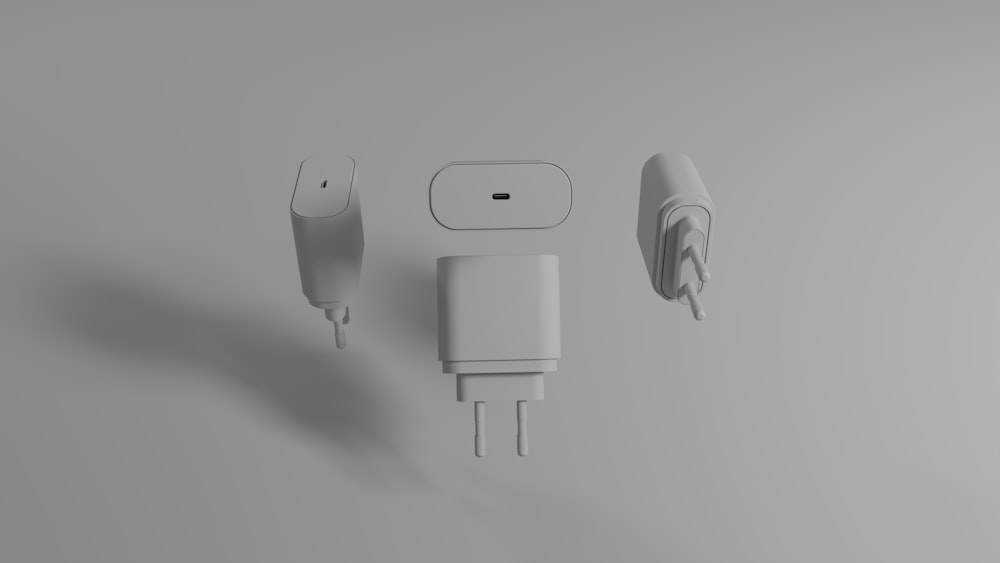 a couple of plugs and a charger on a table
