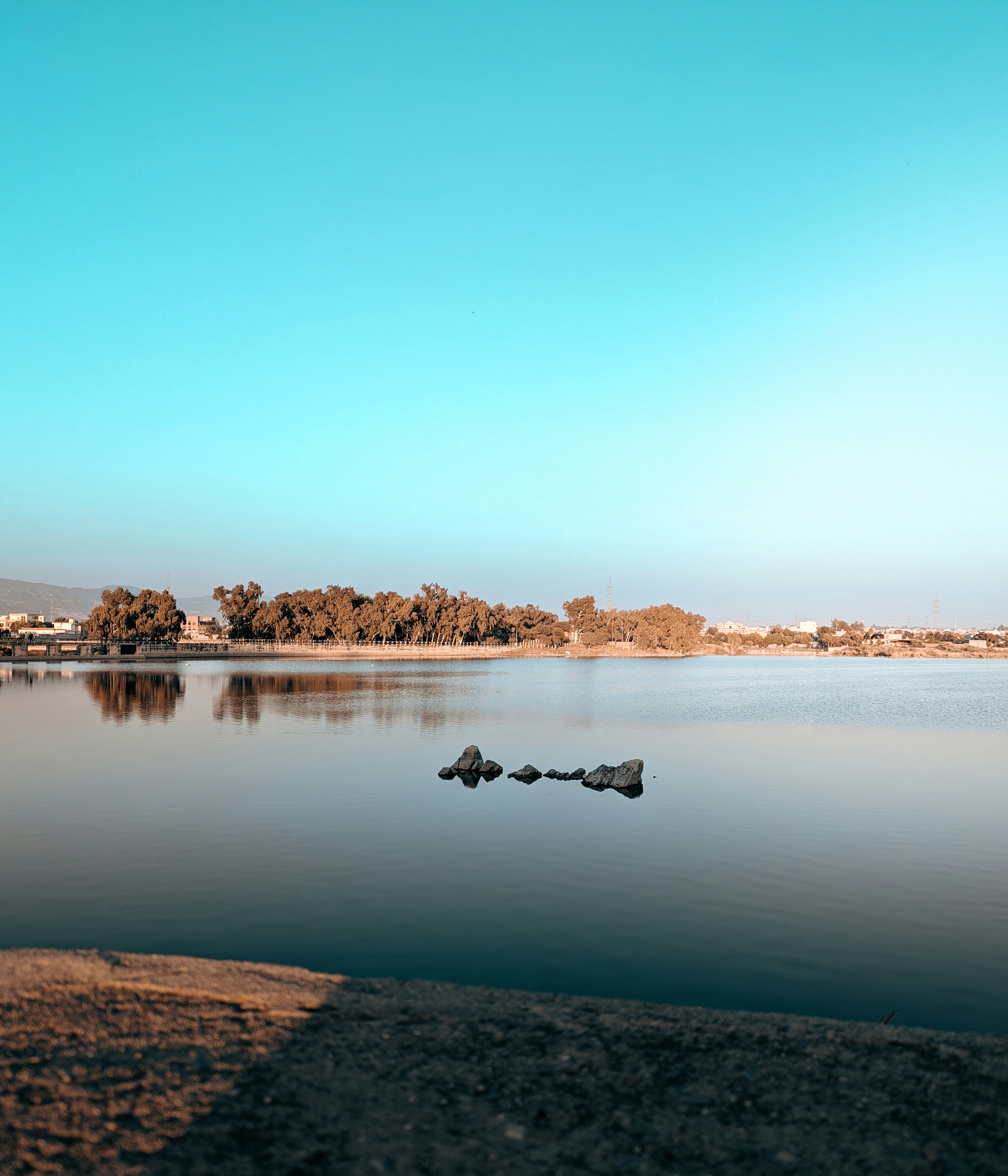 a body of water with a few rocks in it