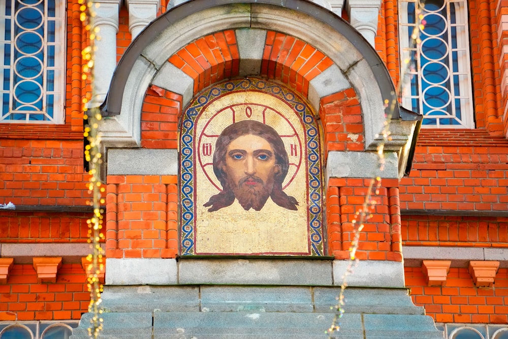 a picture of jesus on the side of a building