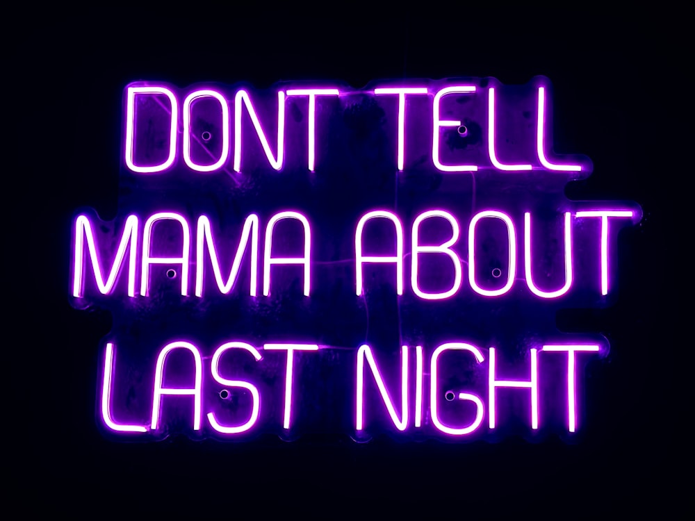 a neon sign that says don't tell mama about last night
