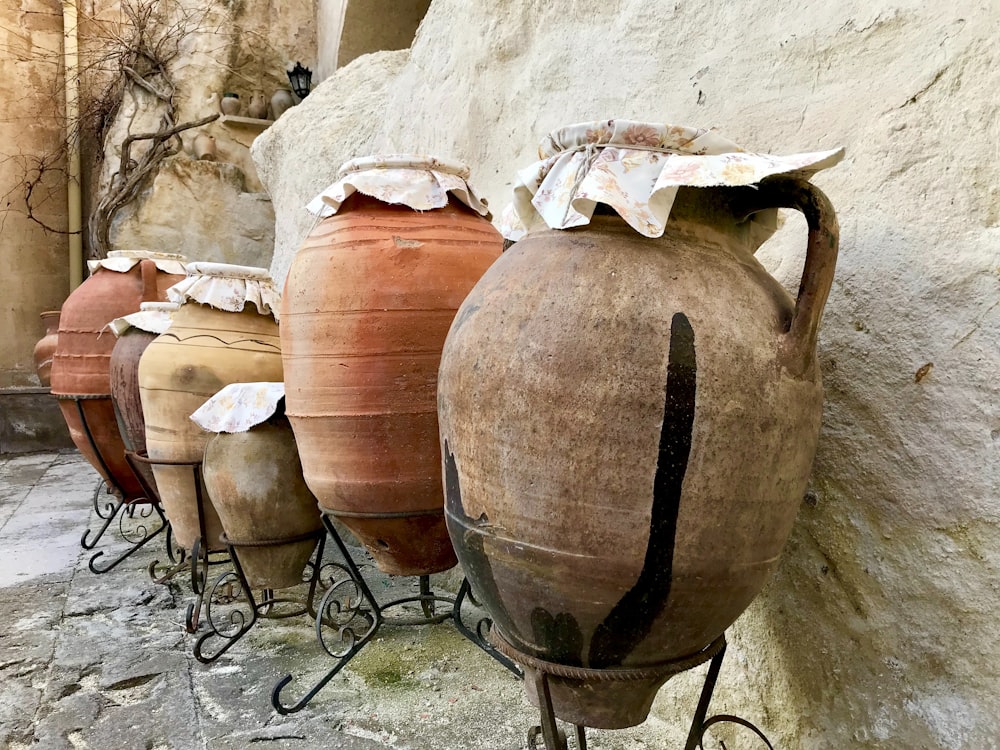 a row of clay pots sitting next to each other