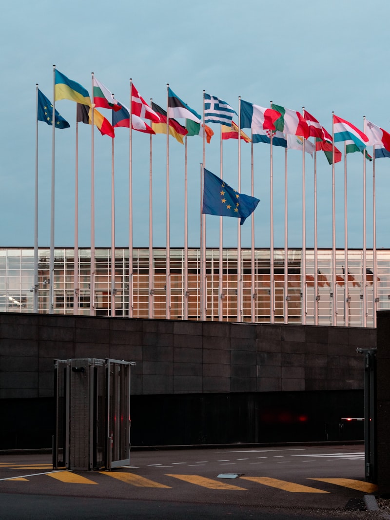 NATO headquarters Brussels, defense ministers meeting, military conference room, Ukraine flag, diplomatic summit