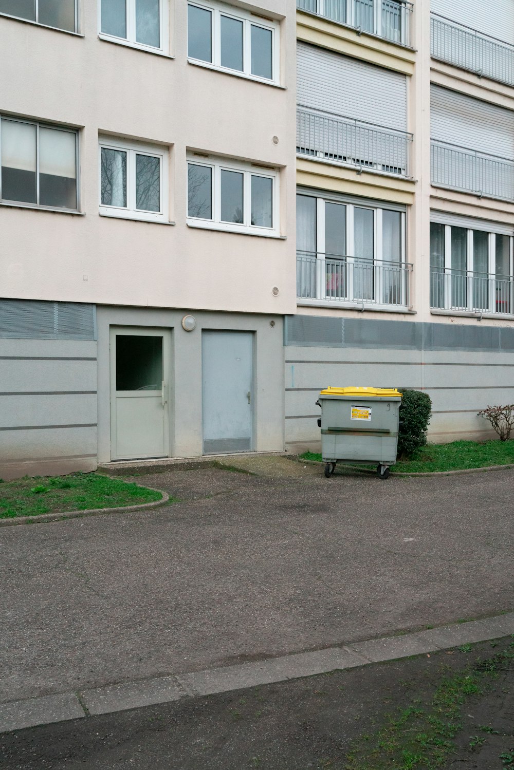 a large building with a yellow door on the side of it