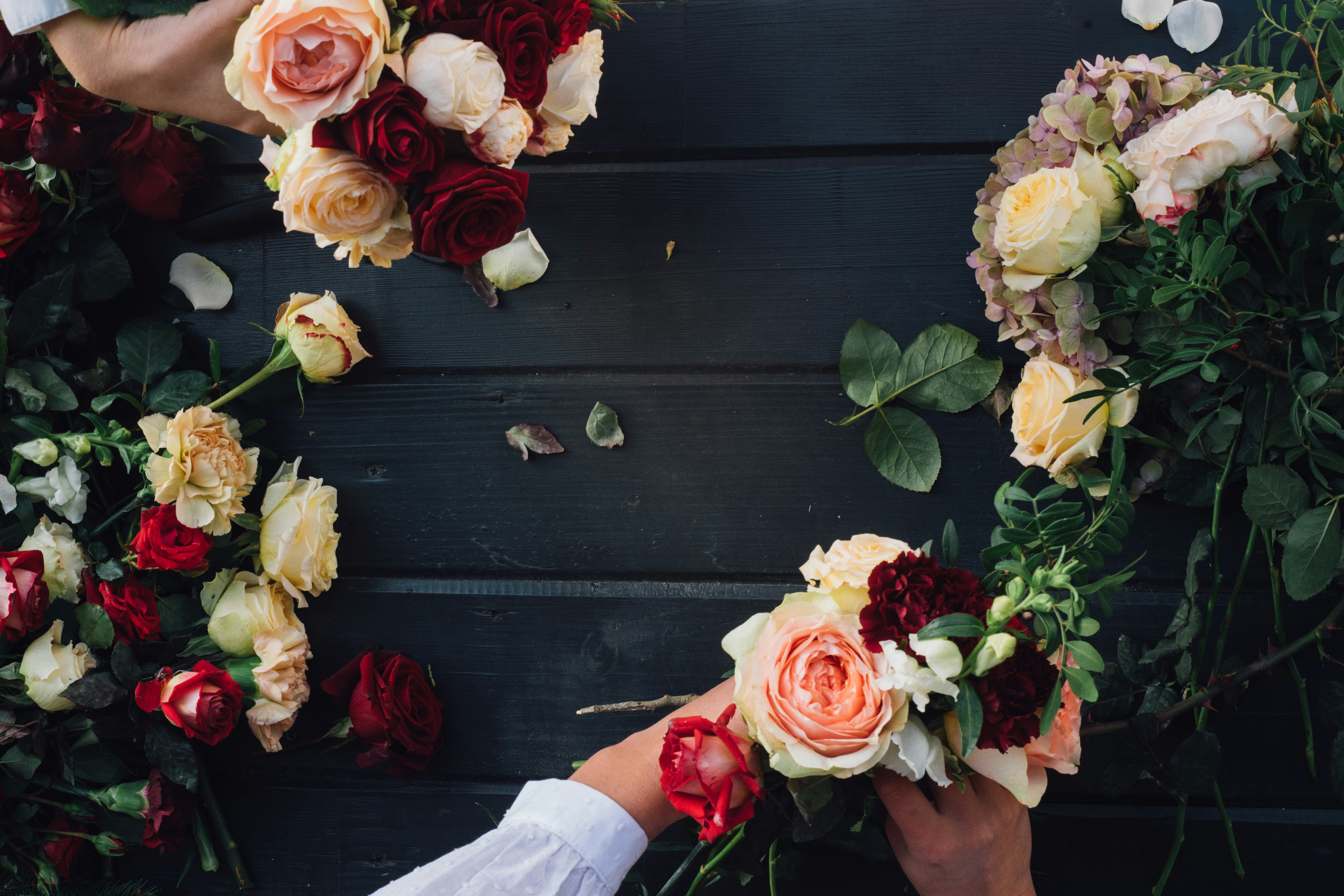 a group of people holding bouquets of flowers