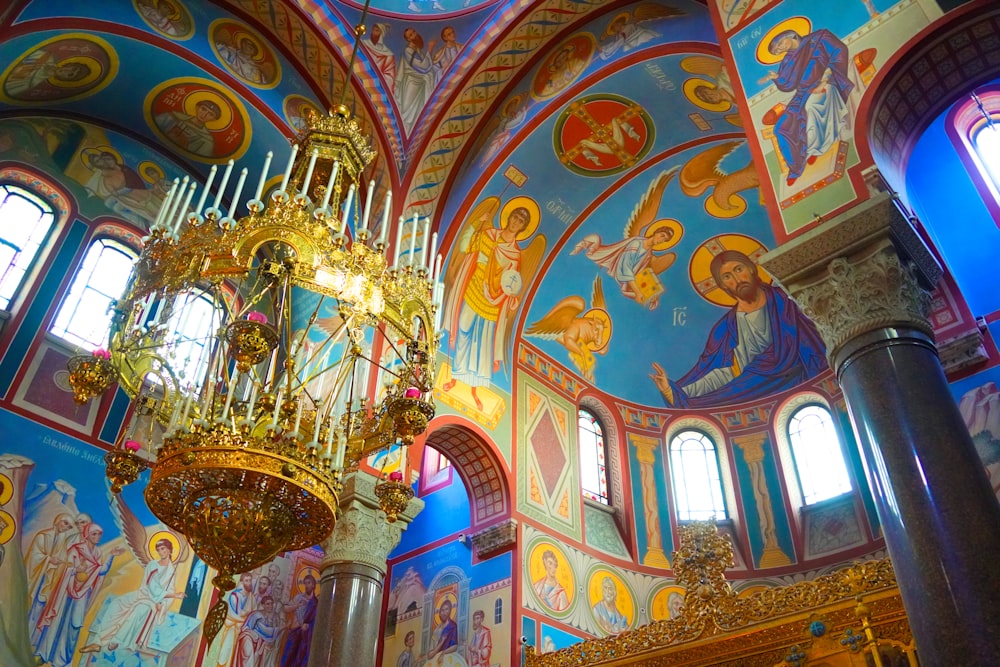 a chandelier hanging from the ceiling of a church