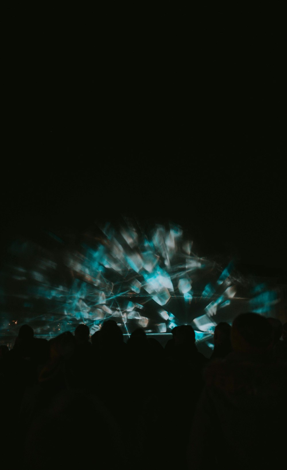 a group of people watching a projection on a screen