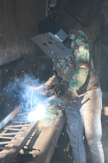a man working on a piece of metal