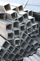 a pile of steel pipes stacked on top of each other