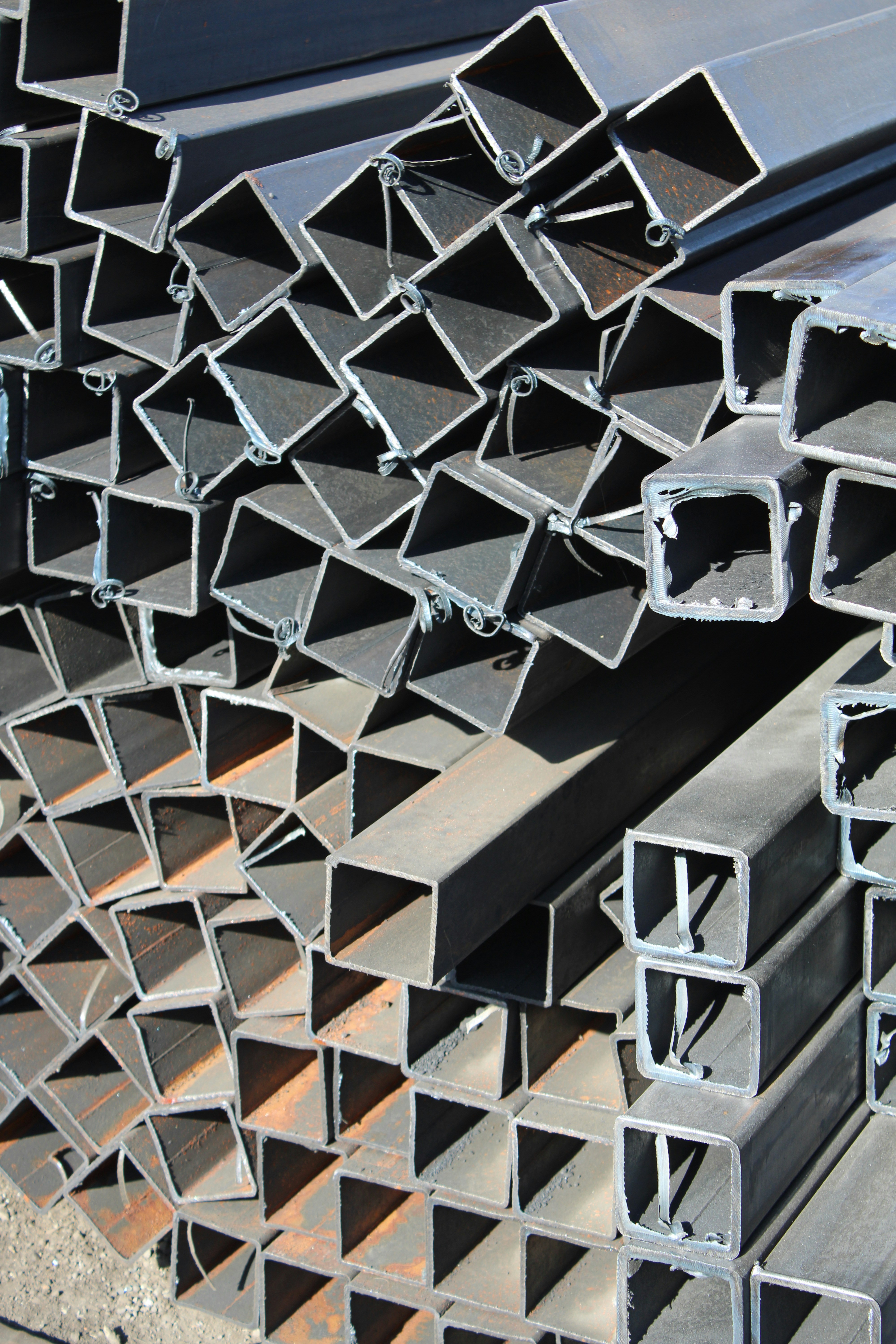 a pile of steel pipes stacked on top of each other