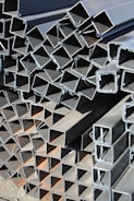 a pile of steel pipes stacked on top of each other