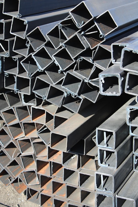 a pile of steel pipes stacked on top of each other