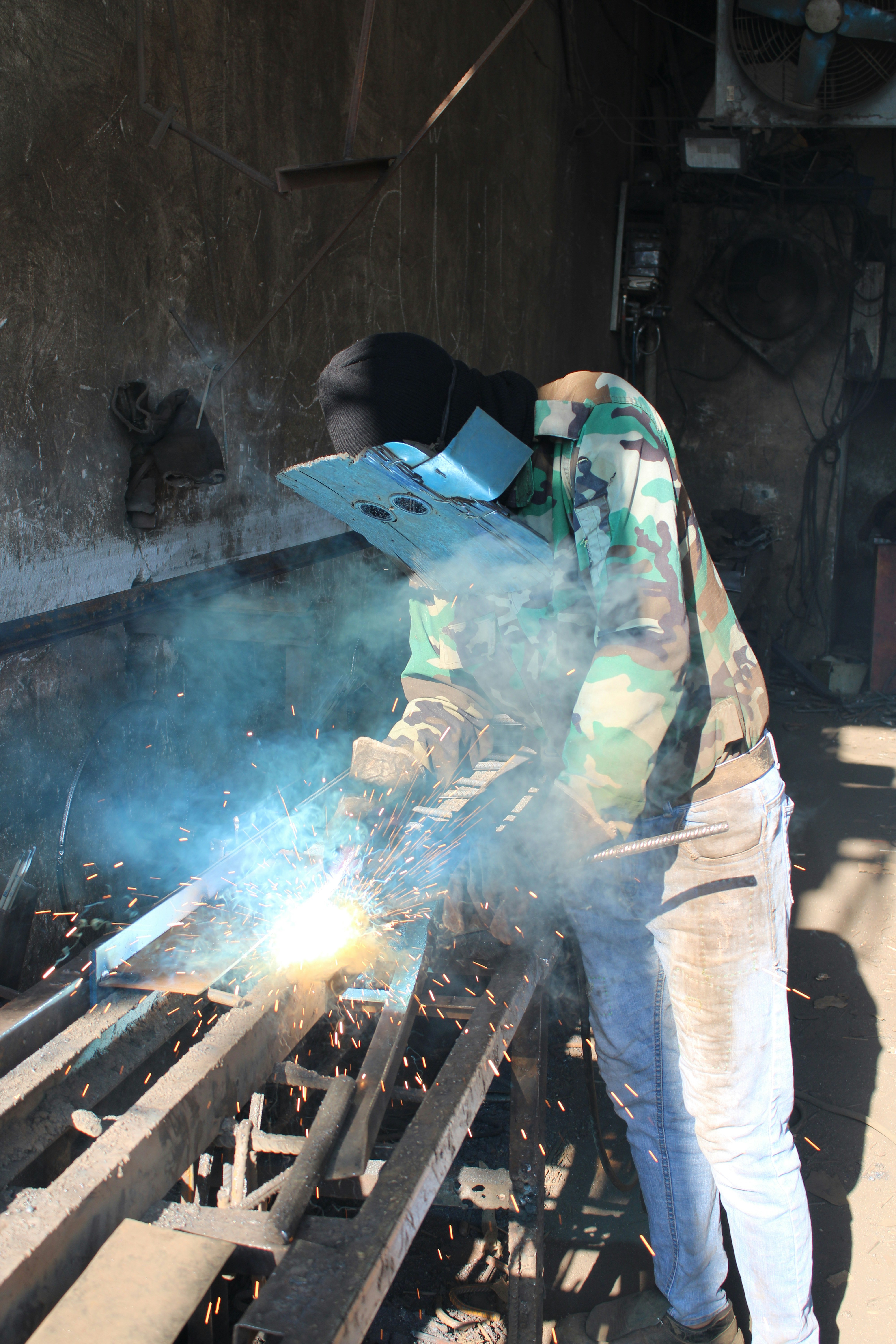 a man working on a piece of metal