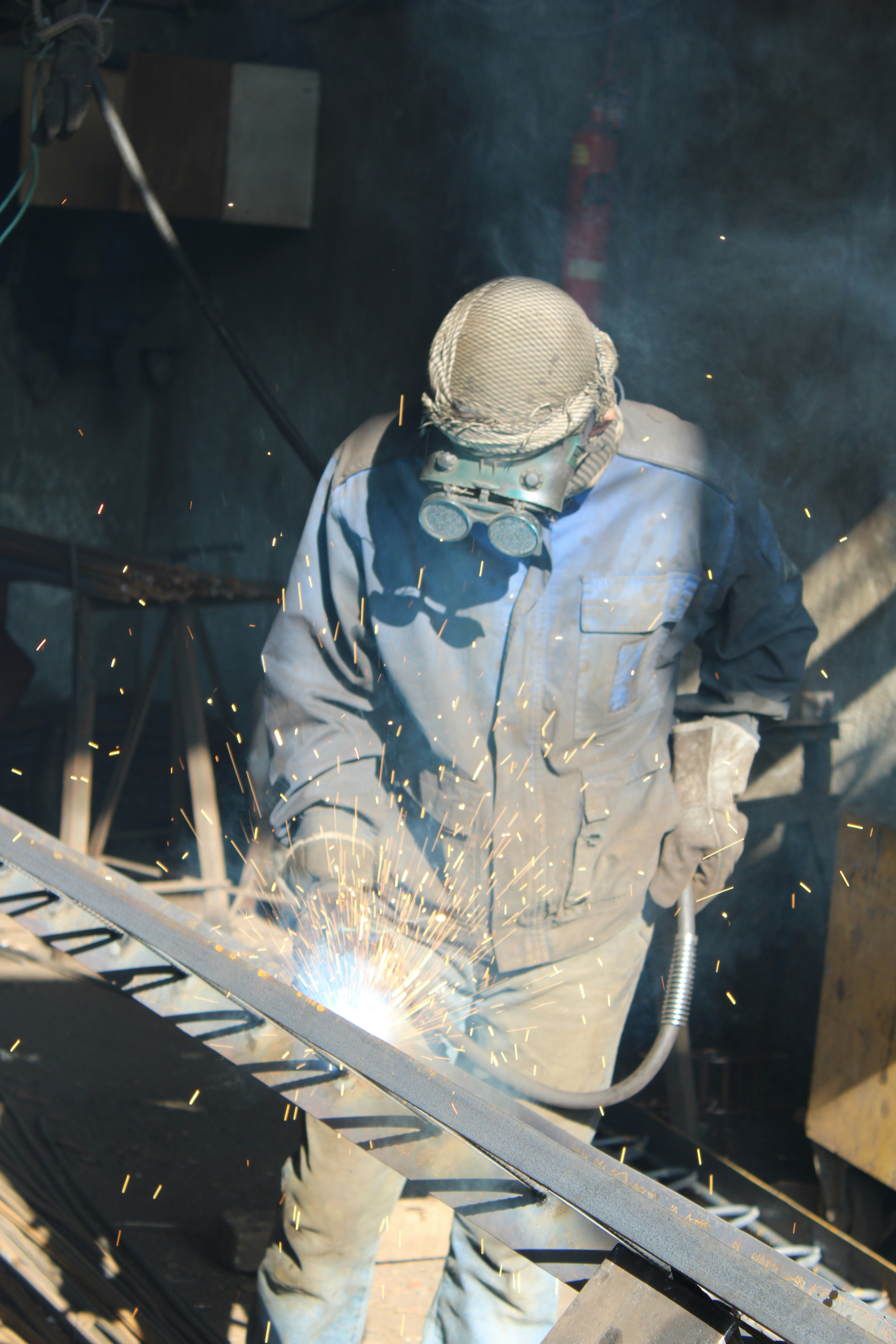 a welder working on a piece of metal